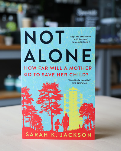 An image of the book cover for Not Alone by Sarah K. Jackson