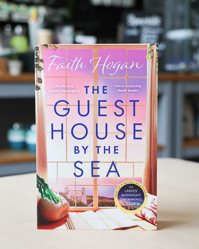An image of the book cover for The Guest House by the Sea by Faith Hogan