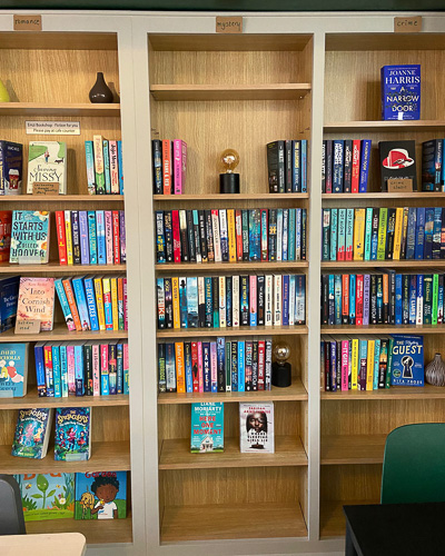 An image showing a bookshelf at Emzi, a cafe in Clifton, Bristol