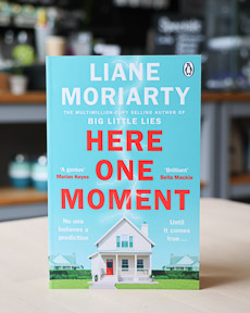 An image of the book cover for Here One Moment by Liane Moriarty
