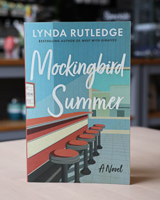 An image of the book cover for Mockingbird Summer by Lynda Rutledge