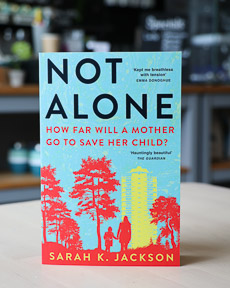 An image of the book cover for Not Alone by Sarah K. Jackson