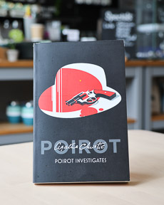 An image of the book cover for Poirot Investigates by Agatha Christie