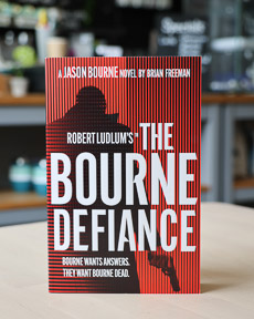 An image of the book cover for Robert Ludlum's The Bourne Defiance by Brian Freeman