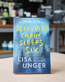 An image of the book cover for Secluded Cabin Sleeps Six by Lisa Unger