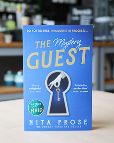 An image of the book cover for The Mystery Guest by Nita Prose