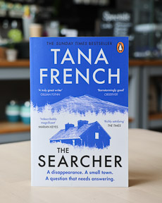 An image of the book cover for The Searcher by Tana French
