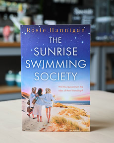 An image of the book cover for The Sunrise Swimming Society by Rosie Hannigan